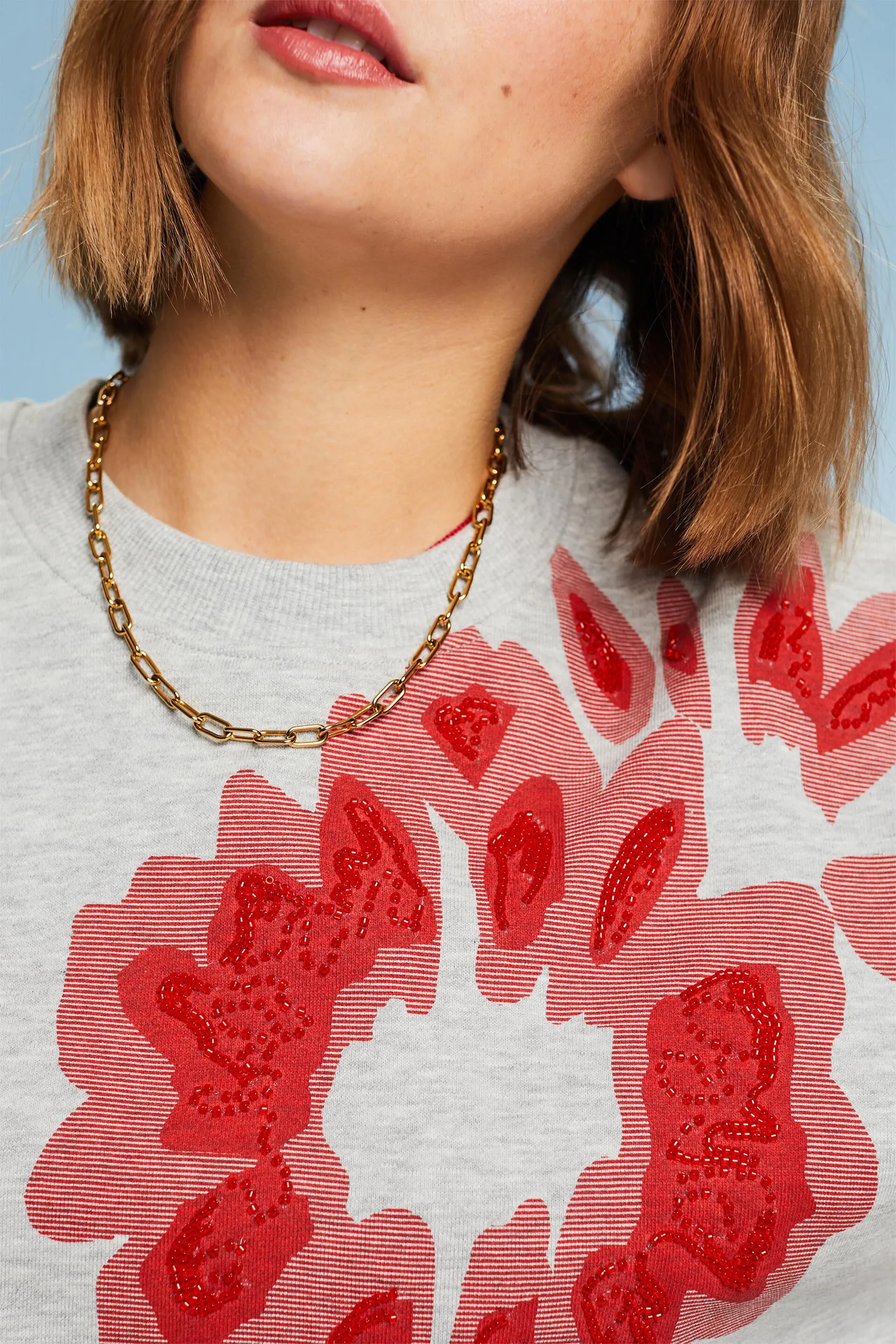 Felpa oversize con perline stampate