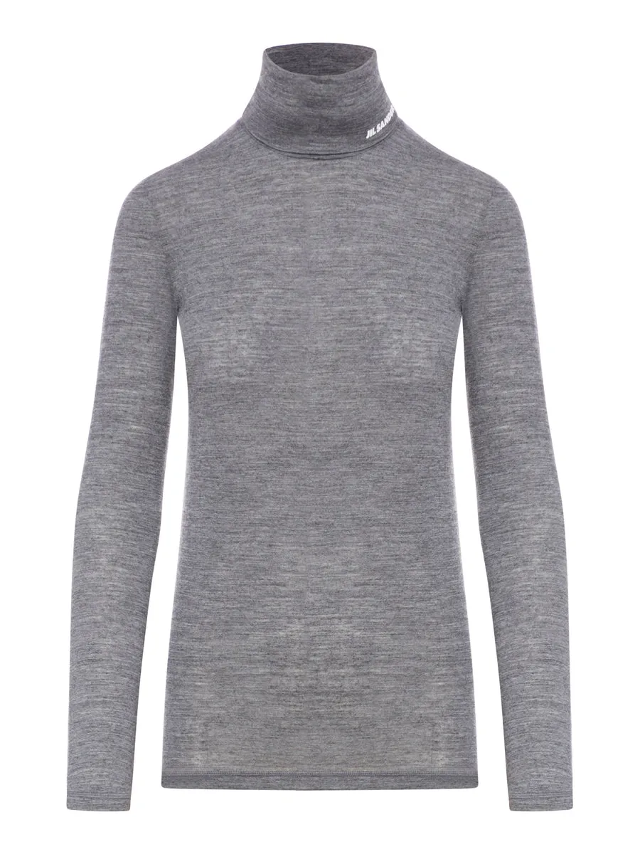 Top a maniche lunghe con scollo a imbuto