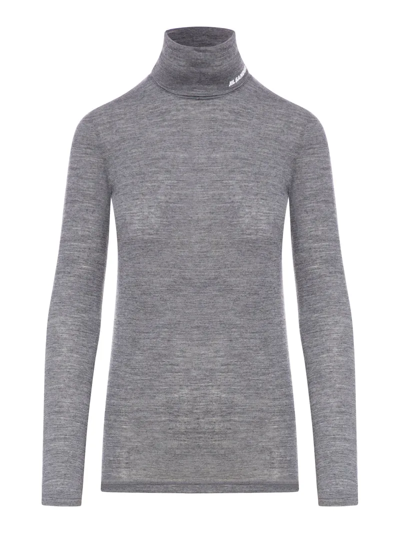 Top a maniche lunghe con scollo a imbuto
